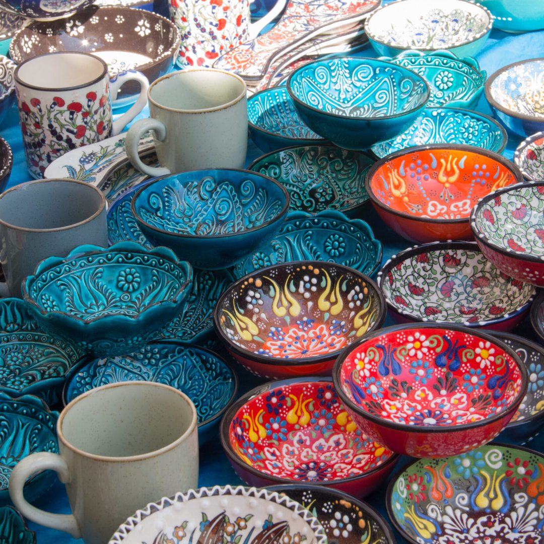Authentic hand made Turkish ceramic bowls with vibrant bright colours and intricate hand painted design at local market. Sourced from Turkey. Can be used as home decor or for serving. Iznik pottery.