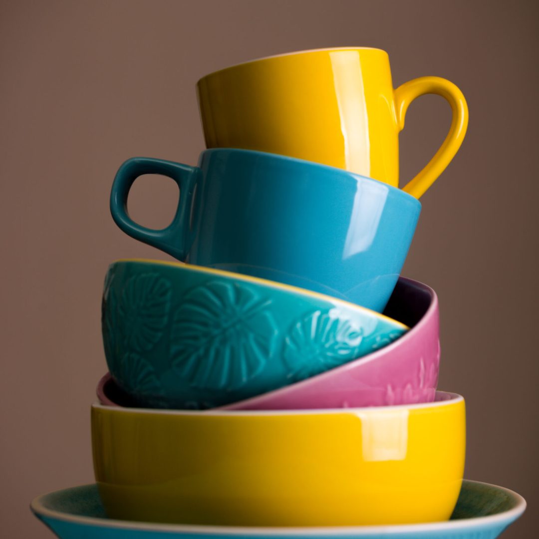 bright ceramics - cups and bowls in blue, yellow and pink colors